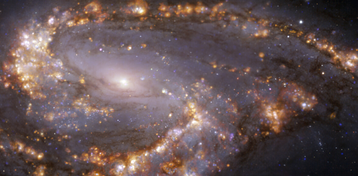 This image, taken with the Multi-Unit Spectroscopic Explorer (MUSE) on ESO’s Very Large Telescope (VLT), shows the nearby galaxy NGC 3627. NGC 3627 is a spiral galaxy located approximately 31 million light-years from Earth in the constellation Leo. The image is a combination of observations conducted at different wavelengths of light to map stellar populations and warm gas. The golden glows mainly correspond to clouds of ionised hydrogen, oxygen and sulphur gas, marking the presence of newly born stars, while the bluish regions in the background reveal the distribution of slightly older stars.  The image was taken as part of the Physics at High Angular resolution in Nearby GalaxieS (PHANGS) project, which is making high-resolution observations of nearby galaxies with telescopes operating across the electromagnetic spectrum. Credit: ESO/PHANGS