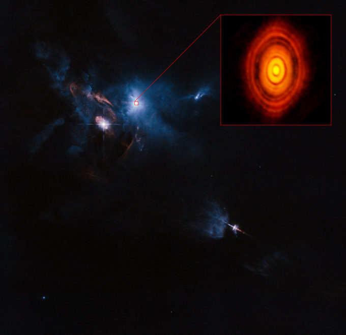 This is the sharpest image ever taken by ALMA — sharper than is routinely achieved in visible light with the NASA/ESA Hubble Space Telescope. It shows the protoplanetary disc surrounding the young star HL Tauri. These new ALMA observations reveal substructures within the disc that have never been seen before and even show the possible positions of planets forming in the dark patches within the system. Credit: ALMA (ESO/NAOJ/NRAO)