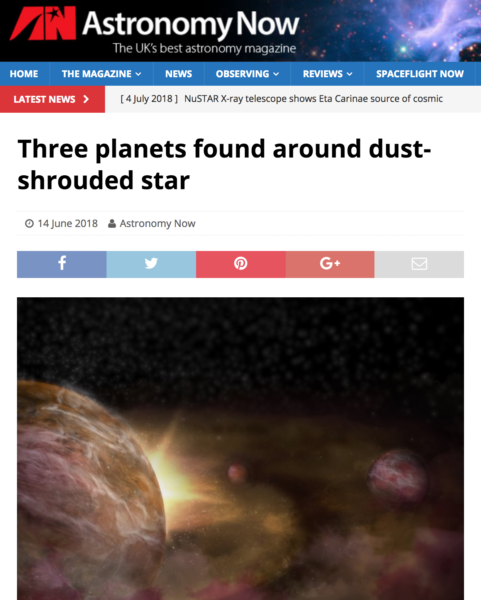 Three planets found around dust-shrouded star